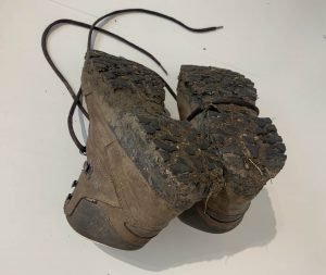 walking boots with mud 1